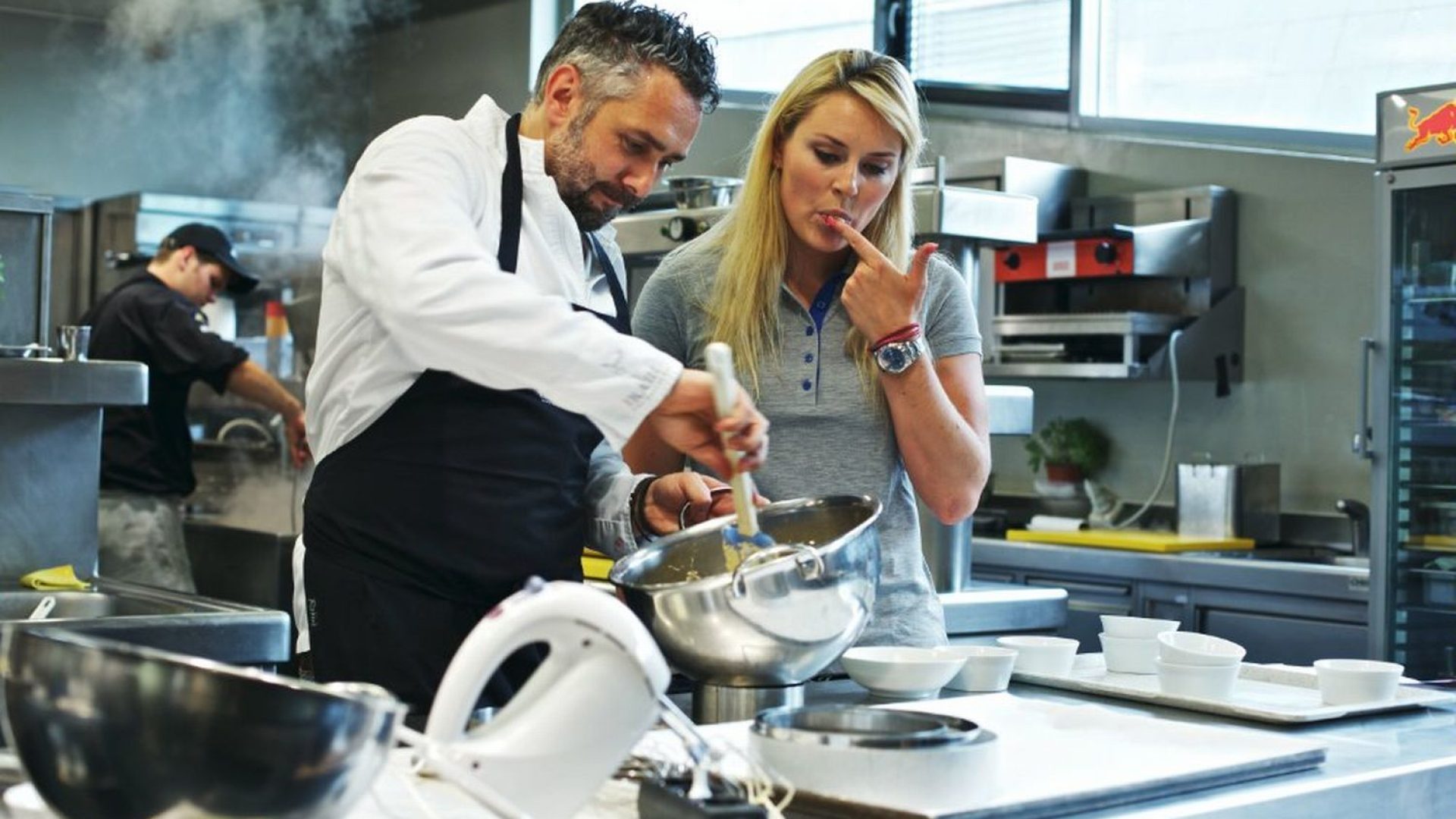 roland-trettl-and-lindsey-vonn-cook-at-the-ikarus-restaurant-located-in-red-bulls-hangar-7